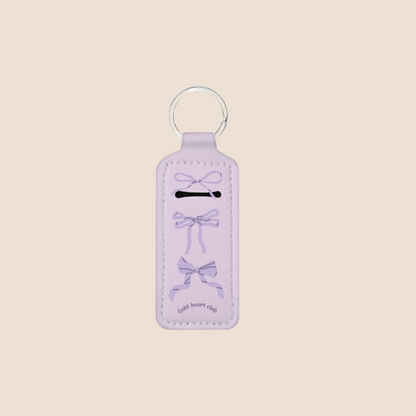 Porte-baume à lèvres motif boucles mauves, pratique à accrocher