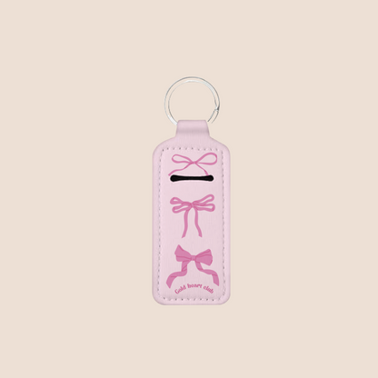 Porte-baume à lèvres avec motif de boucles roses, format pratique