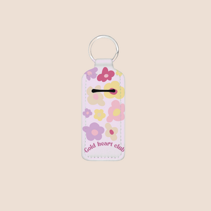 Porte-baume à lèvres décoré de fleurs aux tons pastel